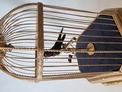 Antique single singing bird in cage, by Karl Griesbaum