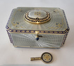 Silver gilt and full radial Guilloche enamel Singing bird box with original silver and enamel key and leather case