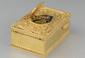 Vintage gilt metal and filigree panel singing bird box, by Karl Griesbaum