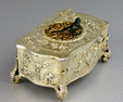 Vintage silver-gilt bow-front form singing bird box, by Karl Griesbaum