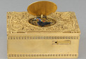 Vintage gilt metal and filigree panel singing bird box, by Karl Griesbaum