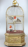 Antique double singing cockatiels-in-cage, by Bontems