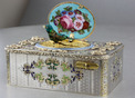 An exceptionally important and early silver, parcel-gilt, enamel and gilt appliques singing bird box, by Charles Bruguier