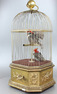 Antique double singing cockatiels-in-cage, by Bontems