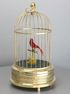 A small single singing bird-in-cage, by Karl Griesbaum