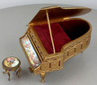 A fine Viennese gilt metal and signed pictorial enamel piano-form musical box and stool