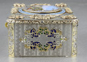 An exceptionally important and early silver, parcel-gilt, enamel and gilt appliques singing bird box, by Charles Bruguier