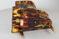 A vintage multi-tone faux tortoiseshell cased grand piano-form musical box