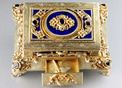 Silver-gilt, enamel, garnet and split-seed pearl mounted singing bird box, by Karl Griesbaum