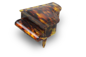 A vintage multi-tone faux tortoiseshell cased grand piano-form musical box