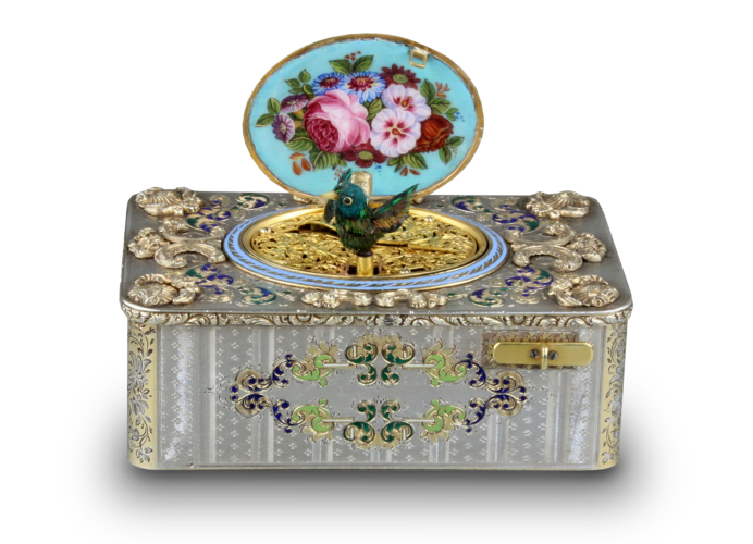 An exceptionally important and early silver, parcel-gilt, enamel and gilt appliques singing bird box, by Charles Bruguier