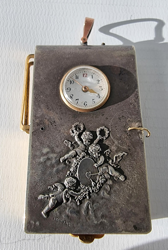 Aide  memoire with watch, photographic portrait and notebook