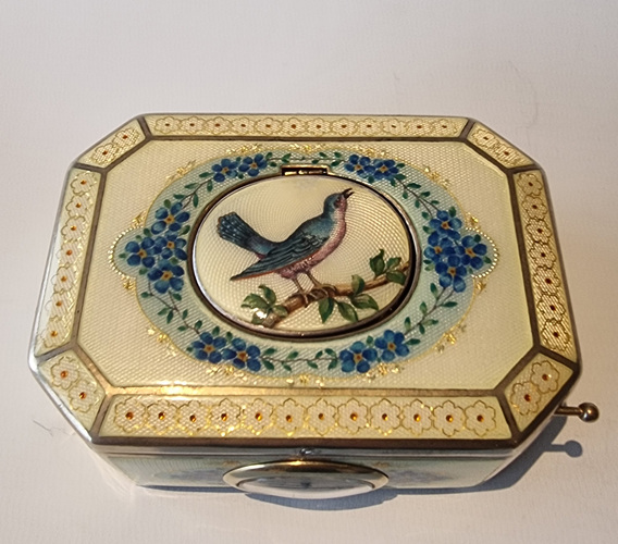 A very fine silver gilt and Imperial Yellow guilloche enamel singing bird box with timepiece, by C. A. Marguerat