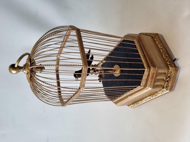 Antique single singing bird in cage, by Karl Griesbaum