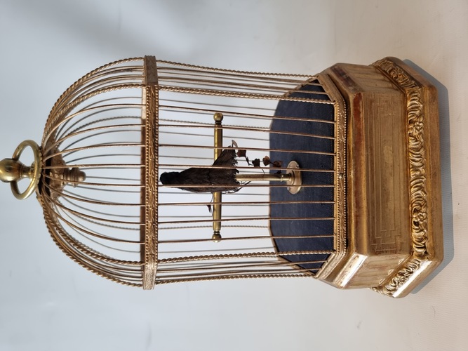 Antique single singing bird in cage, by Karl Griesbaum