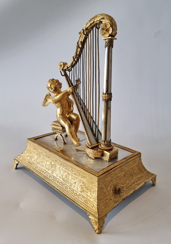 Musical Palais royal Ring stand and jewellery box, of Cupid with harp