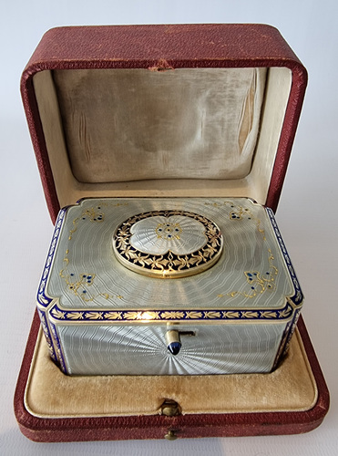 Silver gilt and full radial Guilloche enamel Singing bird box with original silver and enamel key and leather case