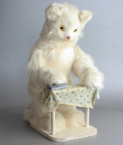 A vintage white cat ironing automaton, by Roullet & Decamps