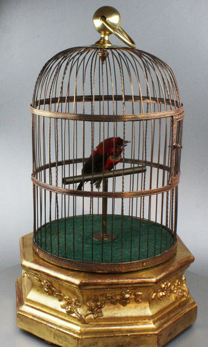 A large Antique hexagonal base antique single singing bird-in-cage, by Bontems