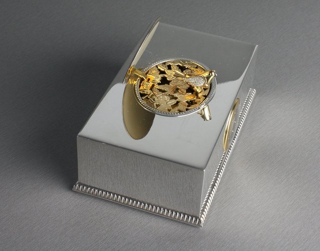 Contempary sterling silver, gold and diamond singing bird box with timepiece, by Reuge