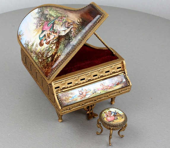 A fine Viennese gilt metal and signed pictorial enamel piano-form musical box and stool