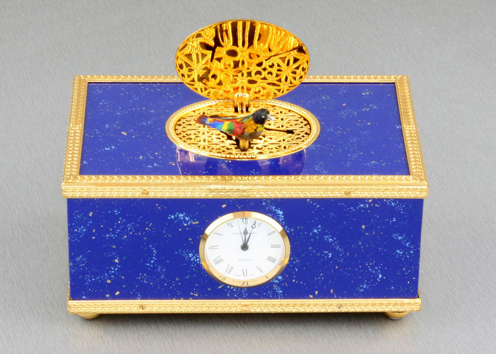 Lapis-lazuli enamelled and gilt musical timepiece alarm-actuated singing bird box, by Reuge