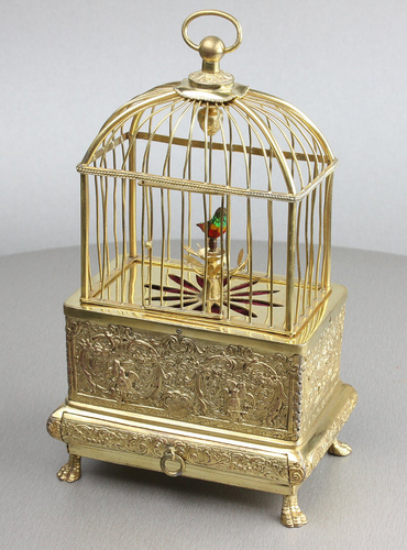 Vintage miniature gilt brass singing bird in cage, by Eschle