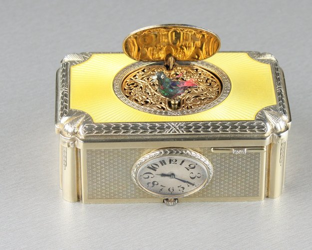 Silver gilt and enamel singing bird box with timepiece, by C. H. Marguerat