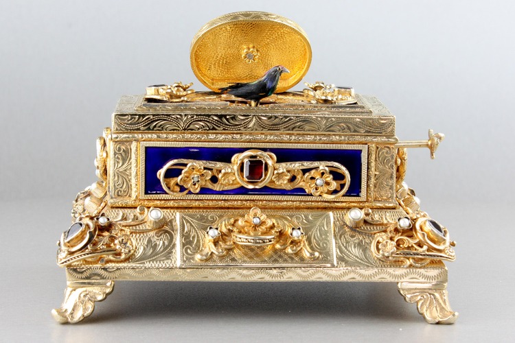 Silver-gilt, enamel, garnet and split-seed pearl mounted singing bird box, by Karl Griesbaum