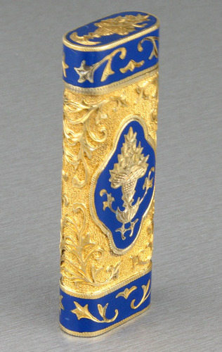 Tooled gilt metal and enamel cigarette lighter, by Cartier