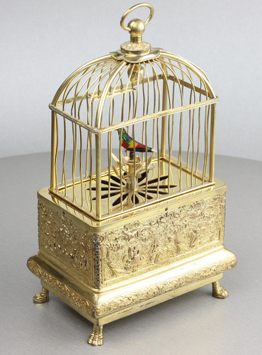 Vintage miniature gilt brass singing bird in cage, by Eschle