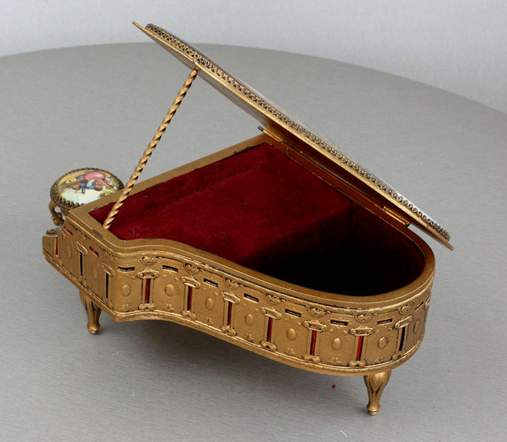 A fine Viennese gilt metal and signed pictorial enamel piano-form musical box and stool