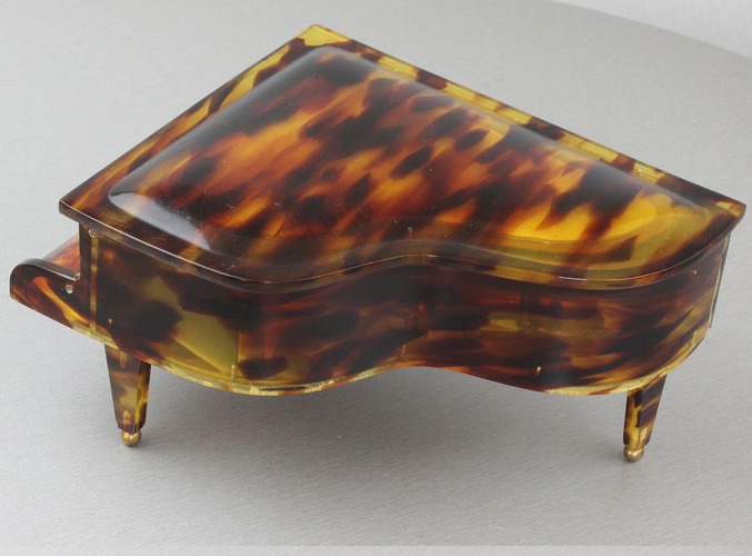 A vintage multi-tone faux tortoiseshell cased grand piano-form musical box