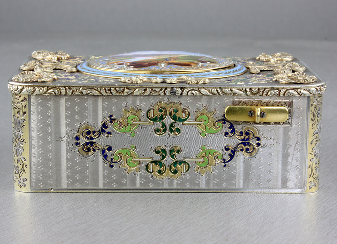 An exceptionally important and early silver, parcel-gilt, enamel and gilt appliques singing bird box, by Charles Bruguier