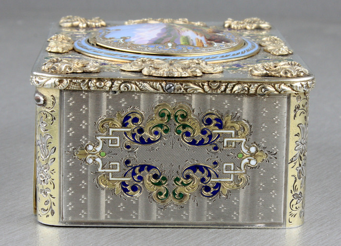 An exceptionally important and early silver, parcel-gilt, enamel and gilt appliques singing bird box, by Charles Bruguier