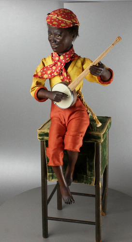 A very rare and fine antique black boy banjo player musical automaton, by Gustave Vichy