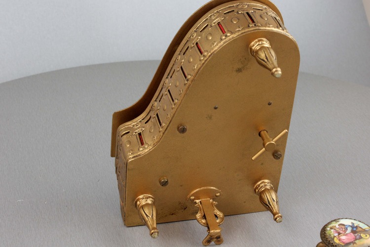 A fine Viennese gilt metal and signed pictorial enamel piano-form musical box and stool