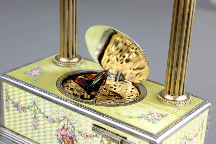 Vintage silver-gilt, guilloche yellow enamel and pictorial enamel timepiece alarm-actuated singing bird box, by C. H. Marguerat