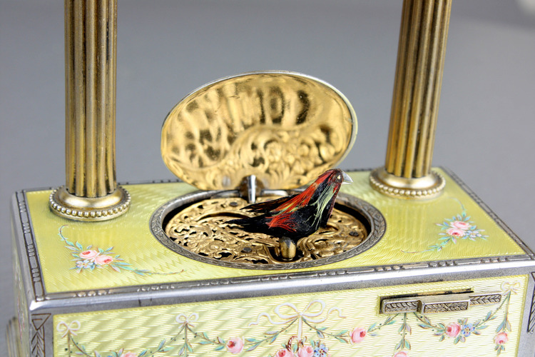 Vintage silver-gilt, guilloche yellow enamel and pictorial enamel timepiece alarm-actuated singing bird box, by C. H. Marguerat