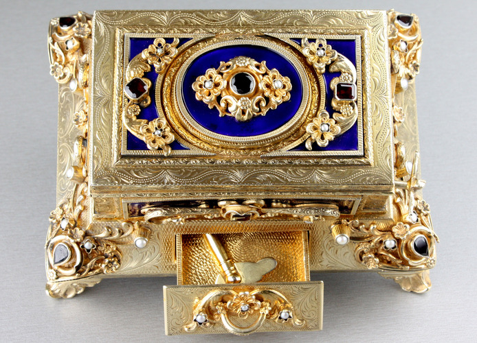 Silver-gilt, enamel, garnet and split-seed pearl mounted singing bird box, by Karl Griesbaum