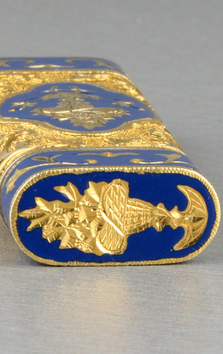 Tooled gilt metal and enamel cigarette lighter, by Cartier