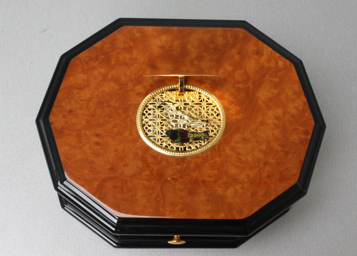 An exclusive and contempary decagonal singing bird card box, by Reuge